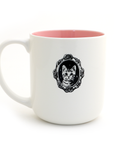 White mug with pink interior and cat illustration on a white background