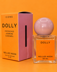 Orange Icons Dolly box beside a glass perfume bottle with a pink sphere cap and orange label, on an orange background