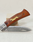 Wooden Cheetah Pocket Knife with a Damascus steel blade and brass cheetah inlay in the wood handle