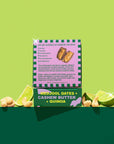 Box of Medjool Dates, Cashew Butter, and Quinoa with ingredients listed on a green background