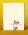 Greeting card with colorful design and text on a yellow background