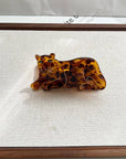 Add a touch of wild style to your hair with this leopard-print claw clip. Made from smooth acetate, it’s lightweight yet strong, keeping your hair secure while adding a bold, playful pattern to any look. Perfect for animal print lovers or anyone looking to make a stylish statement.