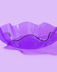 Add a playful pop to any space with this medium wavy acrylic bowl in vibrant purple! Great for corralling small items or adding color to a shelf, this bowl is as functional as it is fun. Mix and match with other sizes and colors for a bold, layered look that stands out.