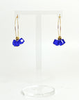 Cool, collected, and effortlessly modern. The Small Anchor Hoops feature a trio of bold cobalt crystal cubes clustered together for a structured, sculptural silhouette. Subtle but striking, they’re your go-to hoops when you want a pop of color with clean, confident lines.