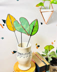 Bring a pop of color and artistry to your home with this handcrafted stained glass elephant ear by Samara Designs Studio. Each piece is made by hand using carefully selected stained glass, cut and assembled with care to create a lasting botanical accent that will never wilt or fade.