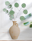 Bring a pop of color and artistry to your home with this handcrafted stained glass silver dollar eucalyptus stem by Samara Designs Studio. This stem is made from beautiful celadon green stained glass, carefully cut and assembled by hand to create a lasting botanical accent that will never wilt or fade.