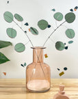 Bring a pop of color and artistry to your home with this handcrafted stained glass silver dollar eucalyptus stem by Samara Designs Studio. This stem is made from beautiful celadon green stained glass, carefully cut and assembled by hand to create a lasting botanical accent that will never wilt or fade.