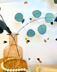 Bring a pop of color and artistry to your home with this handcrafted stained glass silver dollar eucalyptus stem by Samara Designs Studio. This stem is made from beautiful celadon green stained glass, carefully cut and assembled by hand to create a lasting botanical accent that will never wilt or fade.