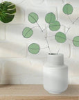 Bring a pop of color and artistry to your home with this handcrafted stained glass silver dollar eucalyptus stem by Samara Designs Studio. This stem is made from beautiful celadon green stained glass, carefully cut and assembled by hand to create a lasting botanical accent that will never wilt or fade.
