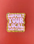 Sticker with 'Support Your Local Everything' text on a red background