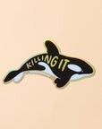 Orca whale sticker with 'KILLING IT' text on a beige background