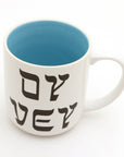 White mug with blue interior and black text on a white background