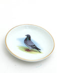 Small dish with a pigeon illustration on a white background