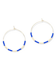 A pair of gold-filled hoop earrings with blue and white beaded details.
