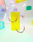 Step into a world of vibrant elegance with our Kaleid Hoops – the epitome of lightweight glamour that dances with bold colors. These hoops are more than just earrings; they're a celebration of your unique style. Prepare to make a dazzling entrance wherever you go as you flaunt the exquisite hand-beaded pattern inspired by the breathtaking colors of Santorini.