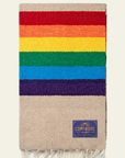 Tan blanket with wide red, orange, yellow, green, blue and purple stripes