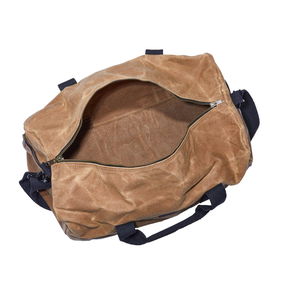 Tan waxed canvas duffel bag unzipped, showing the open main compartment