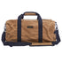 Front of a tan waxed canvas duffel bag with navy webbing handles and a padded shoulder strap, on a white background