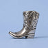 Polished pewter cowboy boot toothpick holder with Western stitching on a light blue background