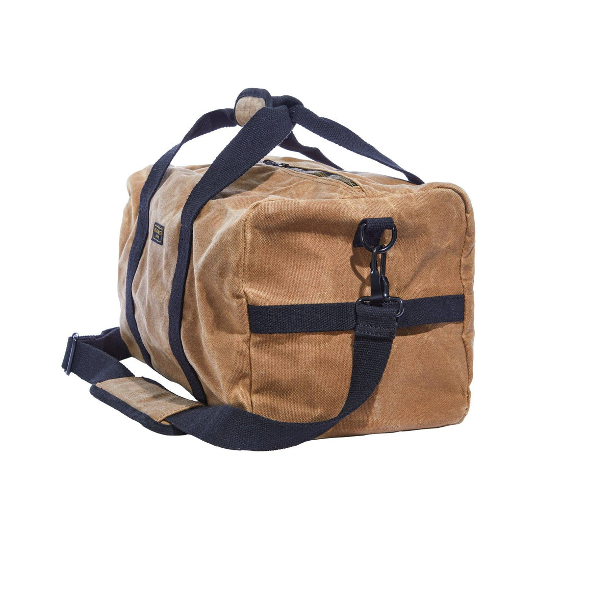 Tan waxed canvas duffel bag from an angle, showing the end panel and shoulder strap clip