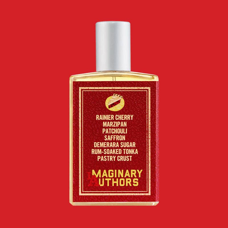 Back of the A Little Secret full-size bottle listing its notes, on a red background