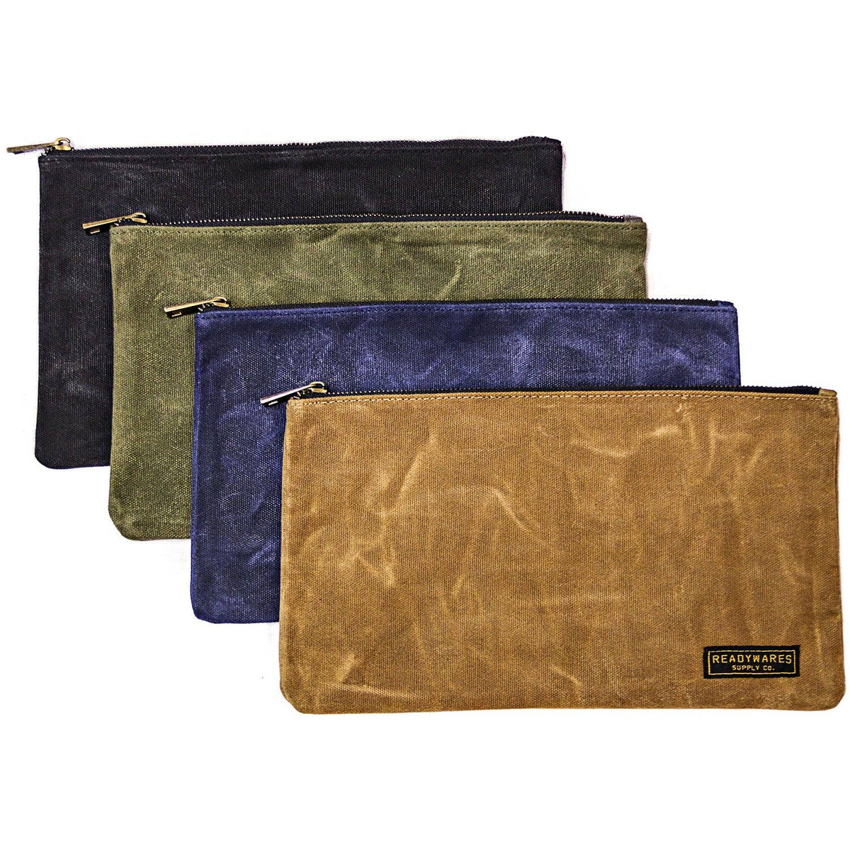 Four waxed canvas zipper tool bags in black, olive, navy and tan, layered on a white background