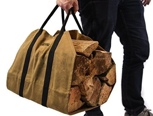Person in dark jeans carrying the firewood carrier loaded with split logs