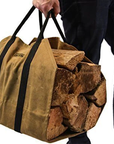 Person in dark jeans carrying the firewood carrier loaded with split logs