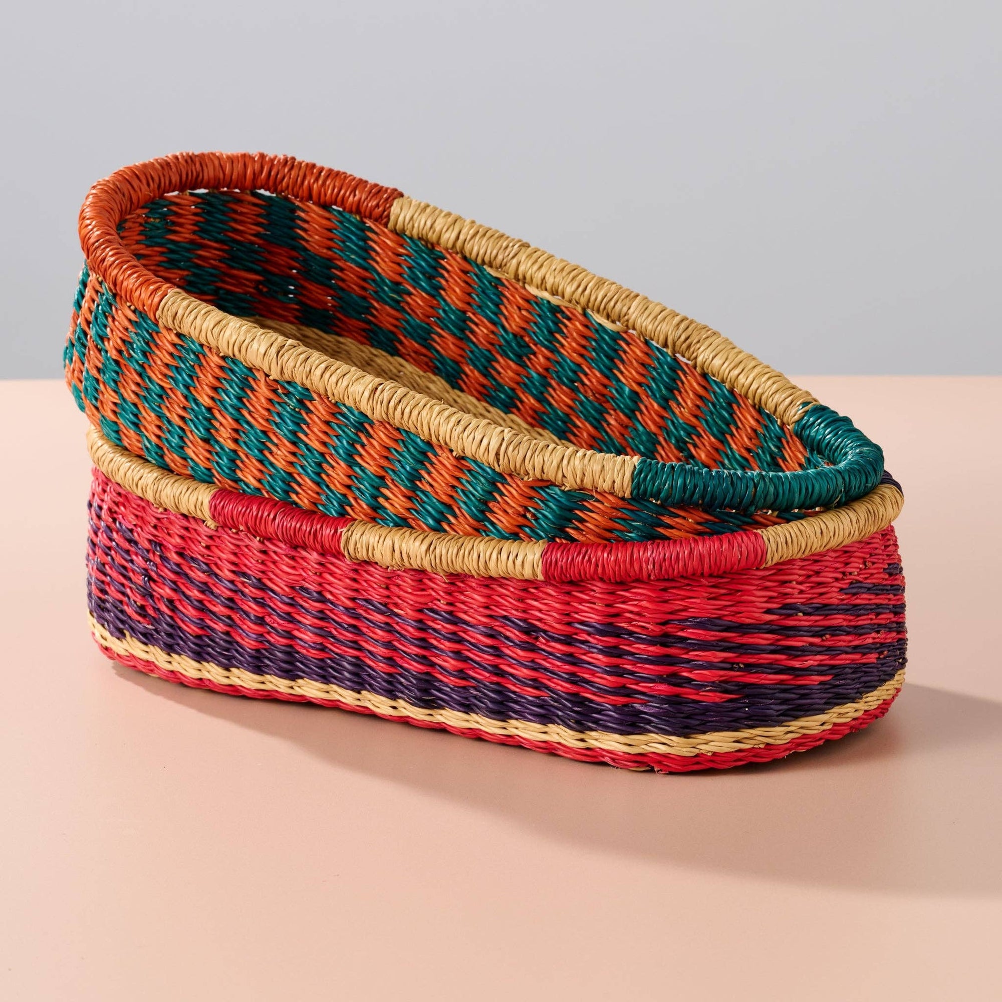 Add these bright, handcrafted baskets to your table, shelf or closet - the uses are limited only by your imagination! Gorgeously handwoven from locally sourced veta vera grass, the utilitarian design features an assortment of vibrant colors. Each one is woven while wet and can be re-shaped by adding water, perfect for the kitchen and bath! Durable and washable, these baskets are a beautiful and unique addition to any decor.&amp;nbsp;