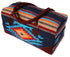 Navy handwoven duffel bag with turquoise, orange and red Southwest diamond pattern and brown suede handles, on a white background