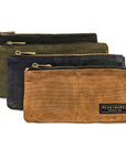 Four waxed canvas zip pouches in black, olive, navy and tan, layered on a white background