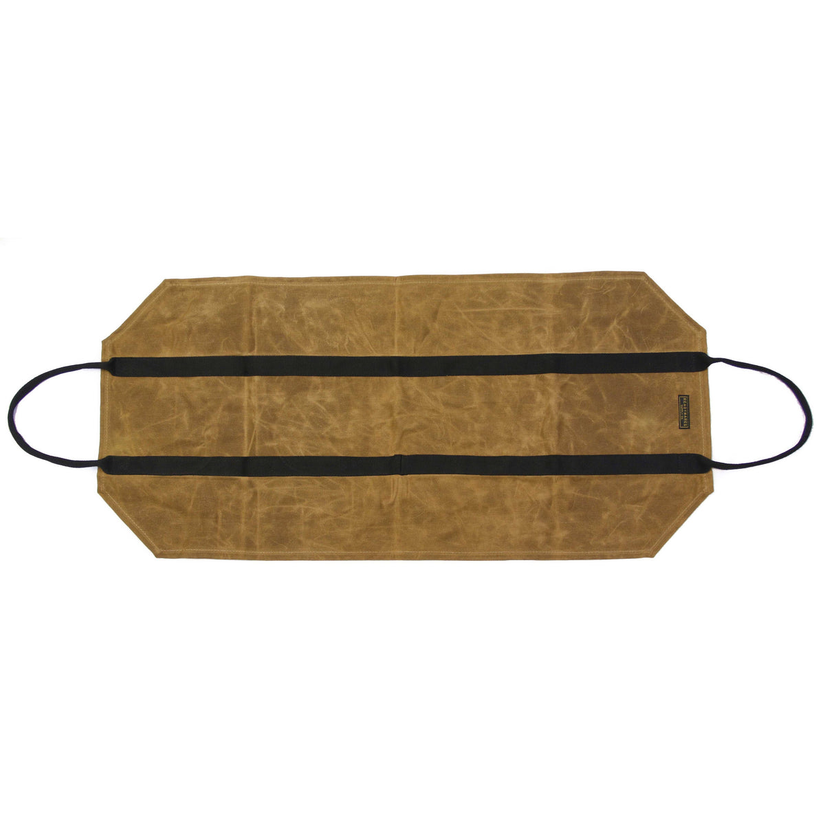 Firewood carrier laid flat, showing the tan waxed canvas body and black webbing handles
