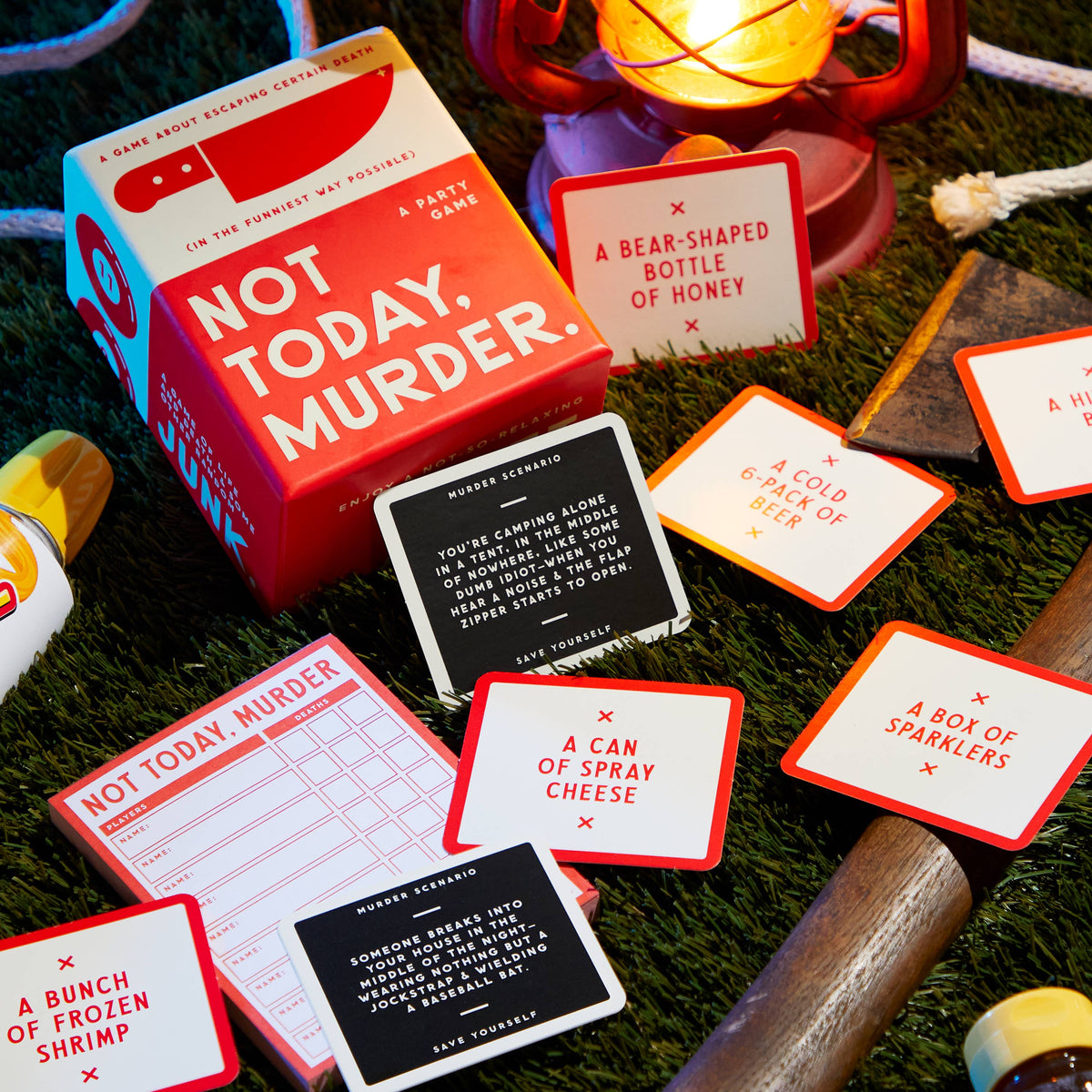 Not Today, Murder game spread out on a table with cards and a lit lamp