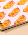 Hot dog A5 spiral notebook with letterpress cover and 48 lined pages. A fun and functional pick for food lovers. Made in the USA with recycled paper.