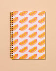 Hot dog A5 spiral notebook with letterpress cover and 48 lined pages. A fun and functional pick for food lovers. Made in the USA with recycled paper.