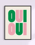 Say it twice with this bold Oui Oui art print. Pink and green text on a clean neutral background adds playful charm to any bathroom or gallery wall.