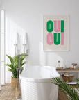 Say it twice with this bold Oui Oui art print. Pink and green text on a clean neutral background adds playful charm to any bathroom or gallery wall.
