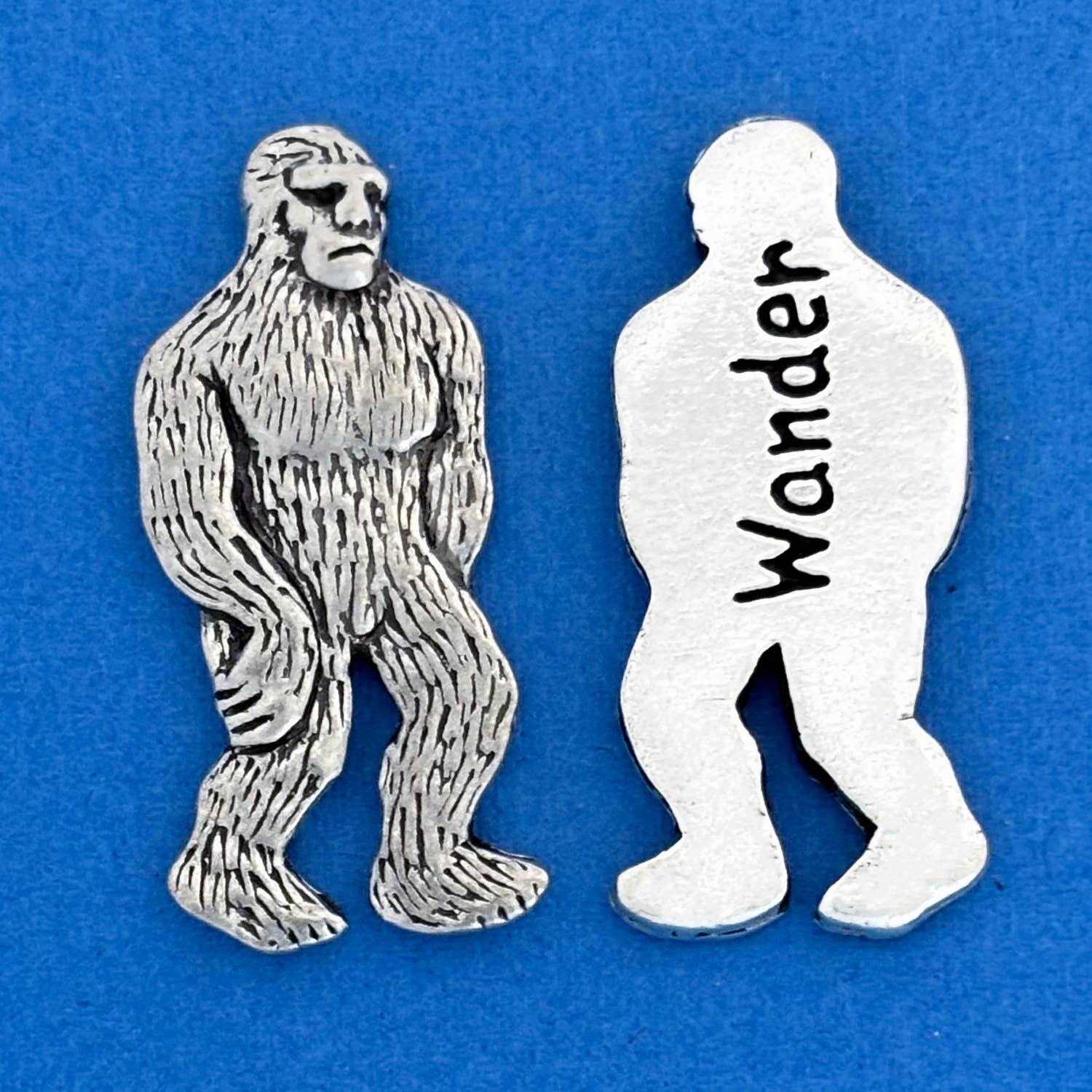 Take a whimsical journey with a Bigfoot Coin! Keep it in your bag or use it to decorate your home. On one side, Bigfoot graces the coin, while the other side playfully reads "Wander". Fine hand-crafted pewter, made in Canada.