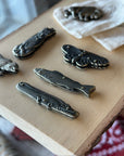 Carry a touch of the wild with Brass Animal Pocket Knives! Stylish, functional, and fun—each features a sturdy metal handle and sharp stainless steel blade.