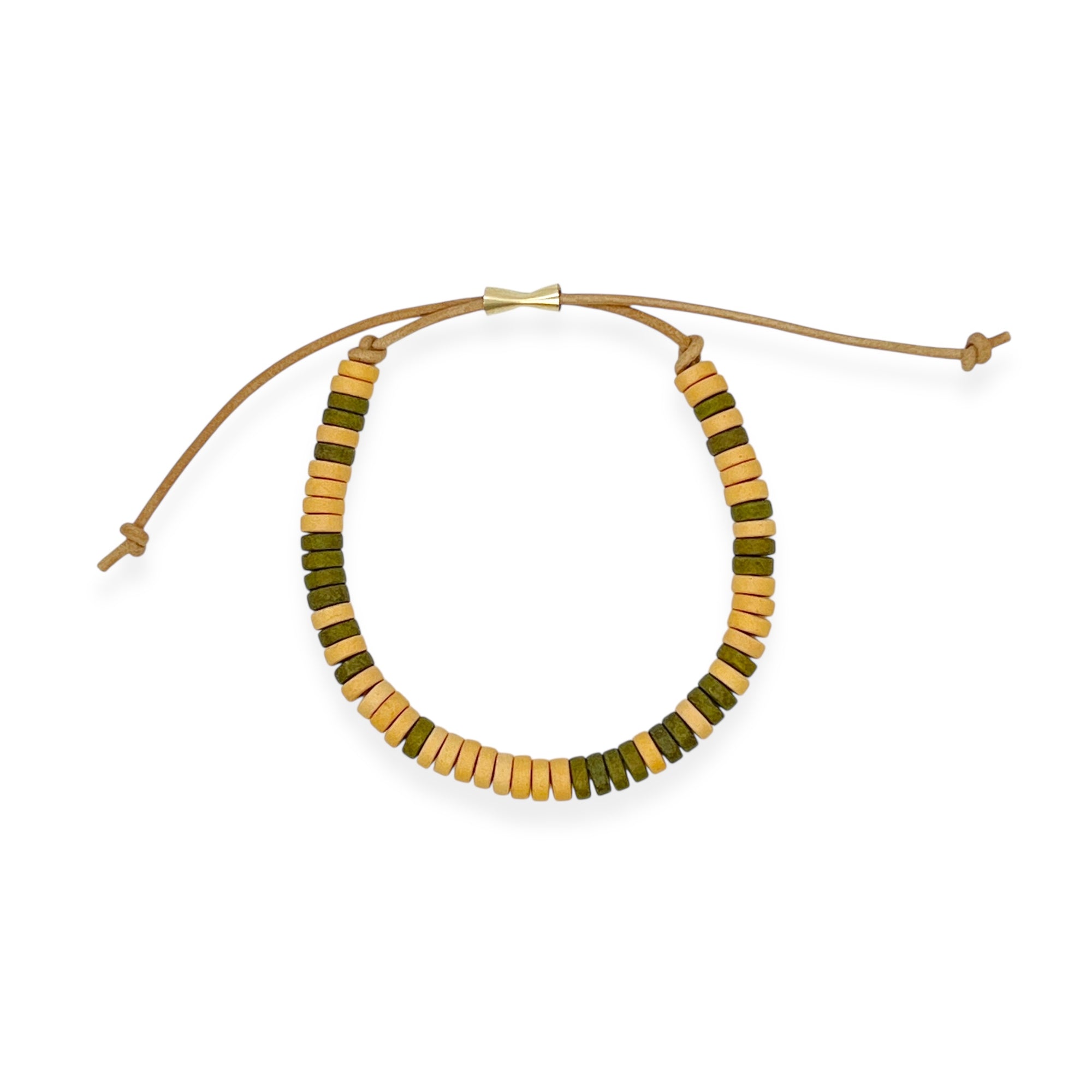 Our ceramic leather beaded bracelet is a grown-up take on the classic friendship bracelet — made for your inner 90s kid with a modern, unisexy edge. Each bracelet is hand-strung with richly glazed ceramic beads and finished with supple leather cord and a 14k gold-filled sliding clasp, creating an effortless mix of earthy texture, graphic punch, and elegant wearability.