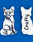 Meet your new favorite pocket companion! Keep it in your bag or use it to decorate your home. On one side, a beautifully detailed fox sits in quiet observation, while the other side cheekily reads 'Crafty.'

Fine hand-crafted pewter, made in Canada.