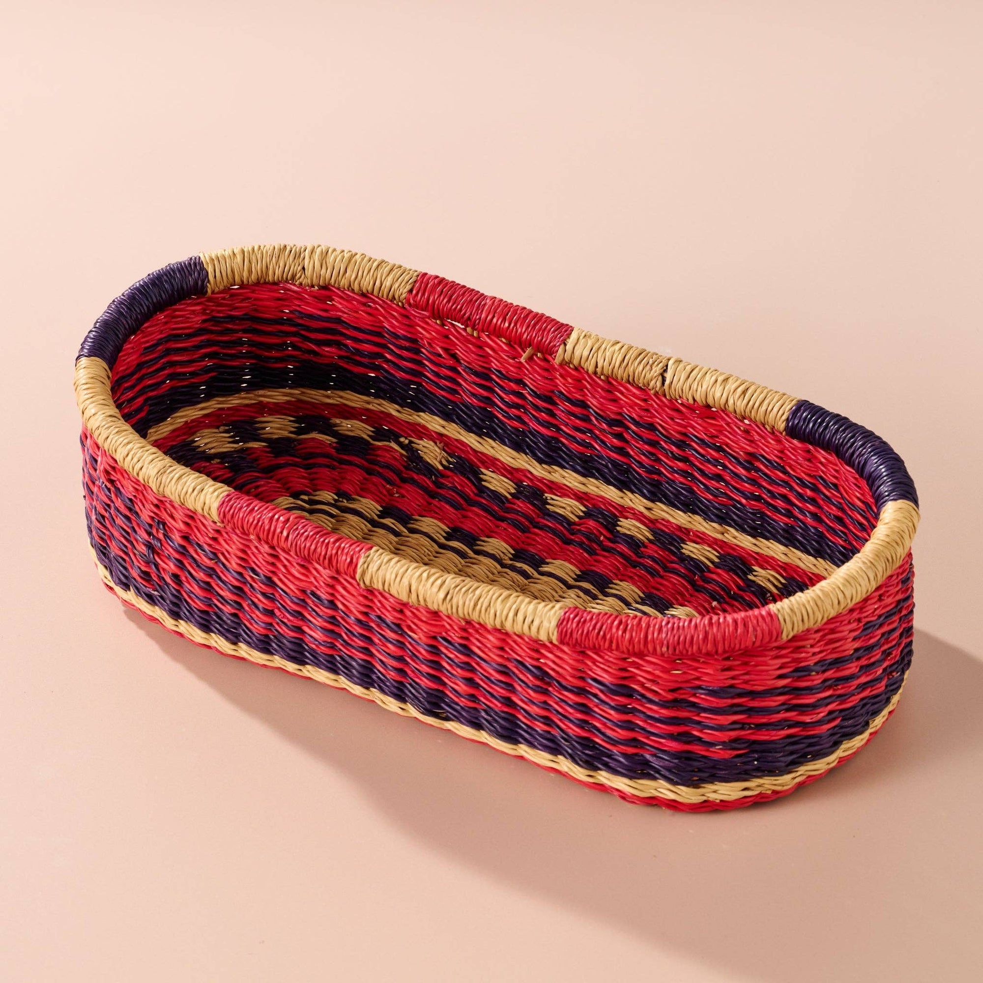 Add these bright, handcrafted baskets to your table, shelf or closet - the uses are limited only by your imagination! Gorgeously handwoven from locally sourced veta vera grass, the utilitarian design features an assortment of vibrant colors. Each one is woven while wet and can be re-shaped by adding water, perfect for the kitchen and bath! Durable and washable, these baskets are a beautiful and unique addition to any decor.&amp;nbsp;