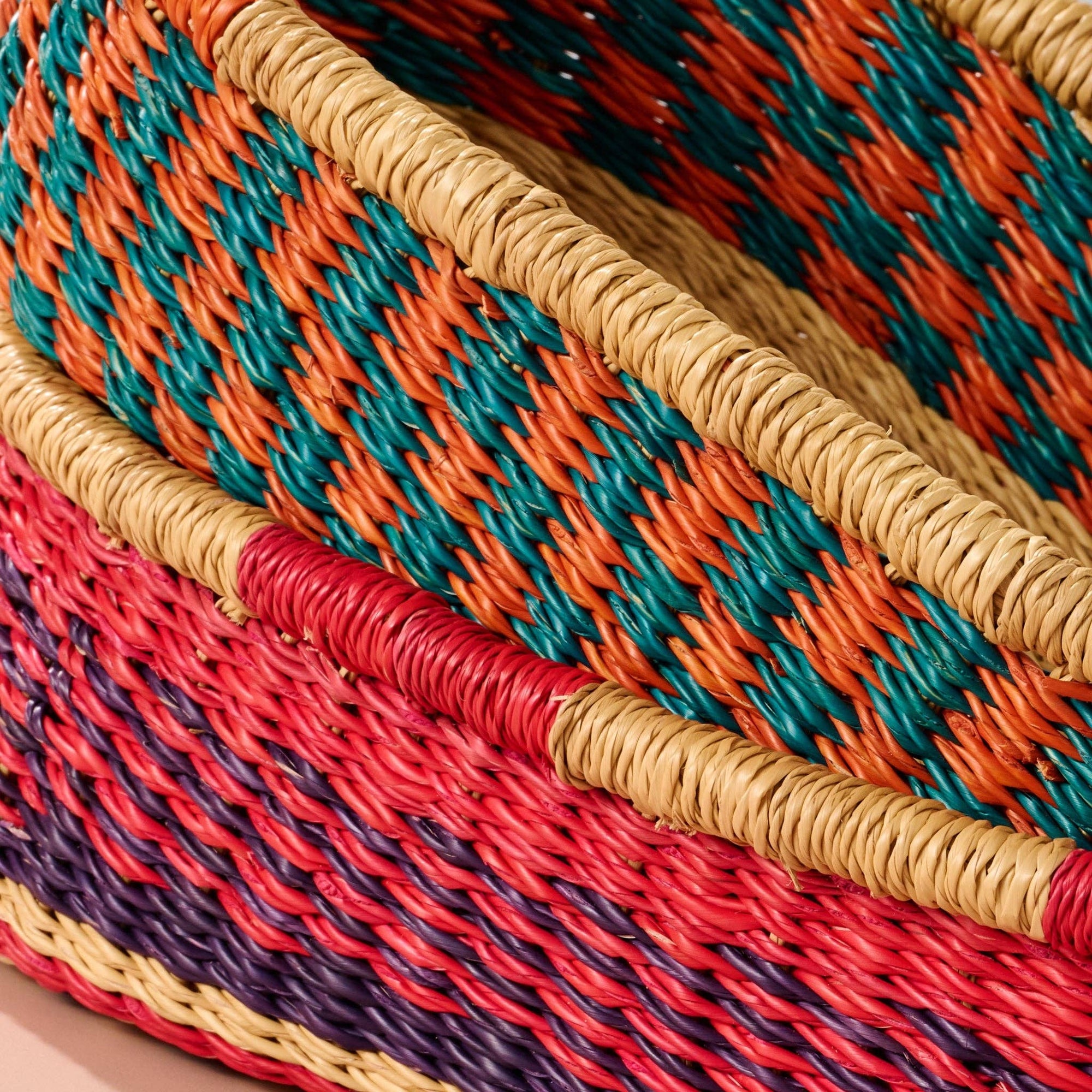 Add these bright, handcrafted baskets to your table, shelf or closet - the uses are limited only by your imagination! Gorgeously handwoven from locally sourced veta vera grass, the utilitarian design features an assortment of vibrant colors. Each one is woven while wet and can be re-shaped by adding water, perfect for the kitchen and bath! Durable and washable, these baskets are a beautiful and unique addition to any decor.&amp;nbsp;