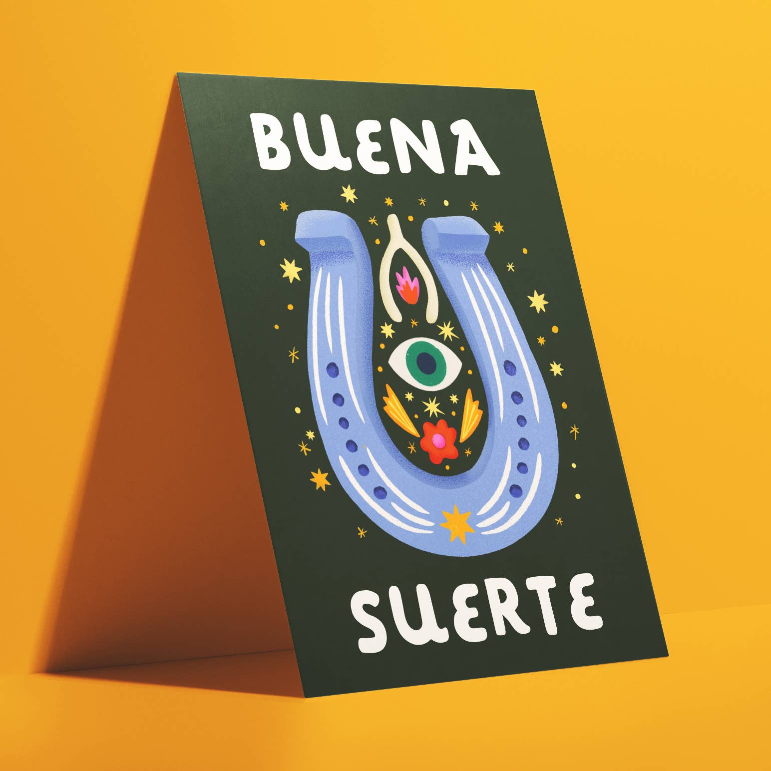 Ana Peake presents Spanish Greeting Cards to convey good luck! Sized A2,&nbsp; these cards are crafted from uncoated paper and feature a blank interior for personalized messages. Each card comes complete with a Kraft Brown Envelope and Plastic Sleeve for protection. Made in the U.S.A., these cards embody quality and cultural expression, making them perfect for various occasions.
