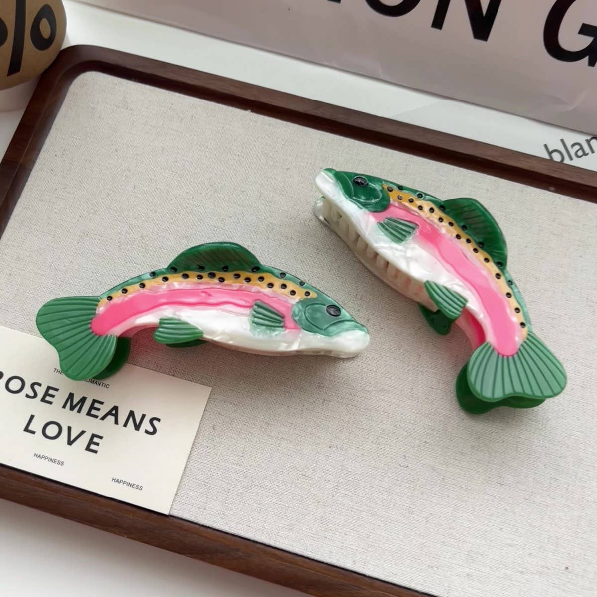 Make a playful, outdoorsy statement with this rainbow trout-shaped hair claw clip. Crafted from smooth acetate, it’s lightweight yet secure, adding a whimsical, nature-inspired touch to your look. Perfect for anglers, animal lovers, or anyone who enjoys a quirky, eye-catching accessory.