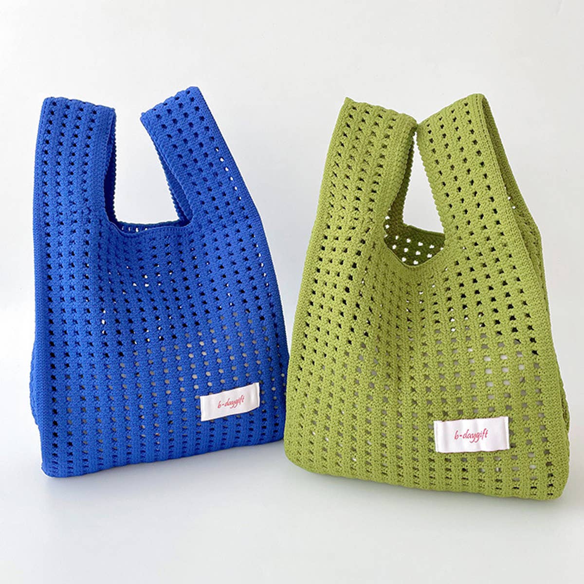 Give your daily style a playful pop with this bright blue knit shoulder bag. Its open, airy weave keeps things lightweight, while the roomy shape makes it perfect for errands, outings, and everything in between. Soft, flexible, and easy to style, it adds a fun hit of texture to any look.