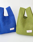 Give your daily style a playful pop with this bright blue knit shoulder bag. Its open, airy weave keeps things lightweight, while the roomy shape makes it perfect for errands, outings, and everything in between. Soft, flexible, and easy to style, it adds a fun hit of texture to any look.