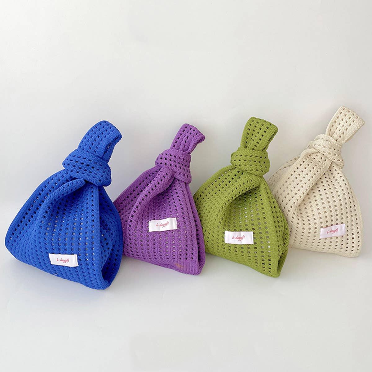 Give your daily style a playful pop with this bright blue knit shoulder bag. Its open, airy weave keeps things lightweight, while the roomy shape makes it perfect for errands, outings, and everything in between. Soft, flexible, and easy to style, it adds a fun hit of texture to any look.