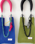 Give your daily style a playful pop with this bright blue knit shoulder bag. Its open, airy weave keeps things lightweight, while the roomy shape makes it perfect for errands, outings, and everything in between. Soft, flexible, and easy to style, it adds a fun hit of texture to any look.