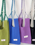 Give your daily style a playful pop with this bright blue knit shoulder bag. Its open, airy weave keeps things lightweight, while the roomy shape makes it perfect for errands, outings, and everything in between. Soft, flexible, and easy to style, it adds a fun hit of texture to any look.